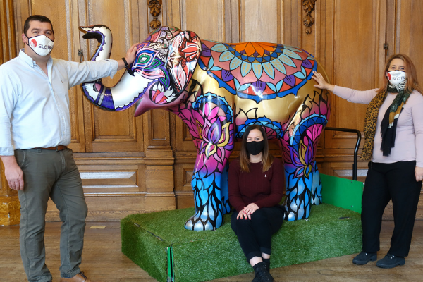 (L to R) Nathan Campsall, Director, SLC Rail, Sara Matthews, St Richard’s Hospice, and Sam Uren, Engineering Director, SLC Rail, pictured with Sundar the elephant. Image taken before November 2020 lockdown commenced.